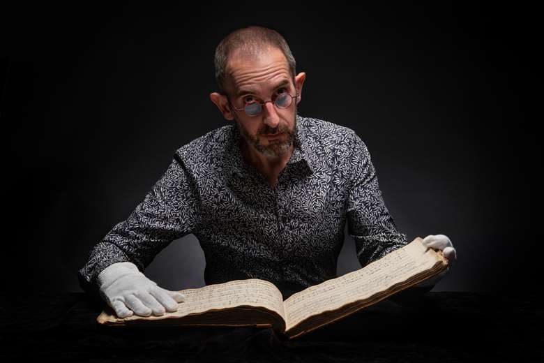 Museum of London librarian Lluis Tembleque Teres with Emma Hamilton’s songbook © John Chase/Museum of London