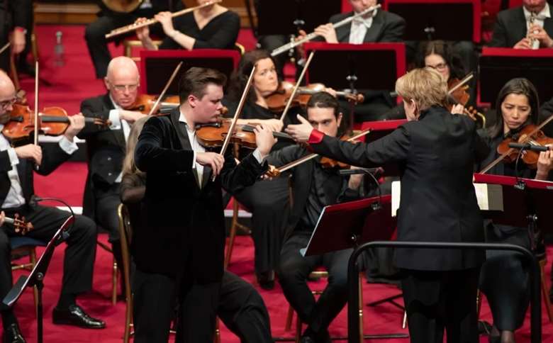 Violinist Daniil Bulayev, who won the competition in 2021, performs in his Prize Concerto Performance with conductor Marin Alsop (Image courtesy of the Windsor Festival International String Competition)