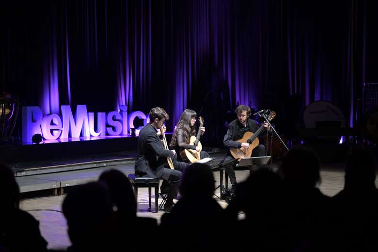 Kosovan guitarist Petrit Çeku performs alongside Diar Aliu and Tringa Sidiku ©Arban Llpashtica 